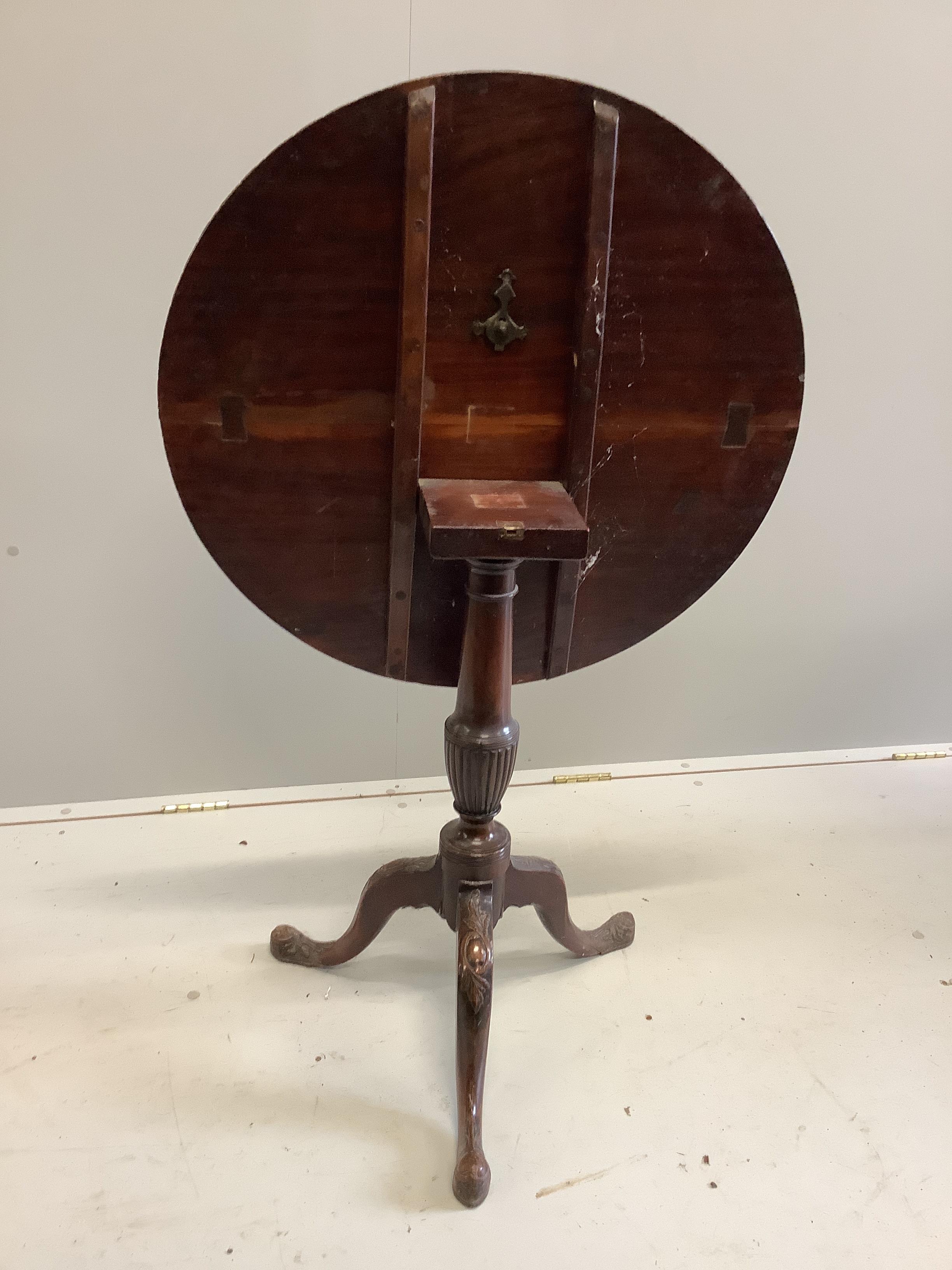 A George III style circular mahogany tilt top tripod tea table, diameter 76cm, height 72cm